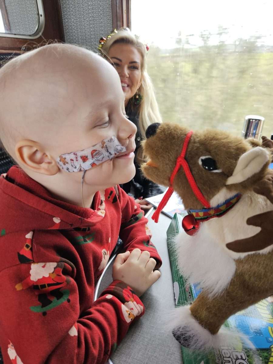 A child on the santa steam train